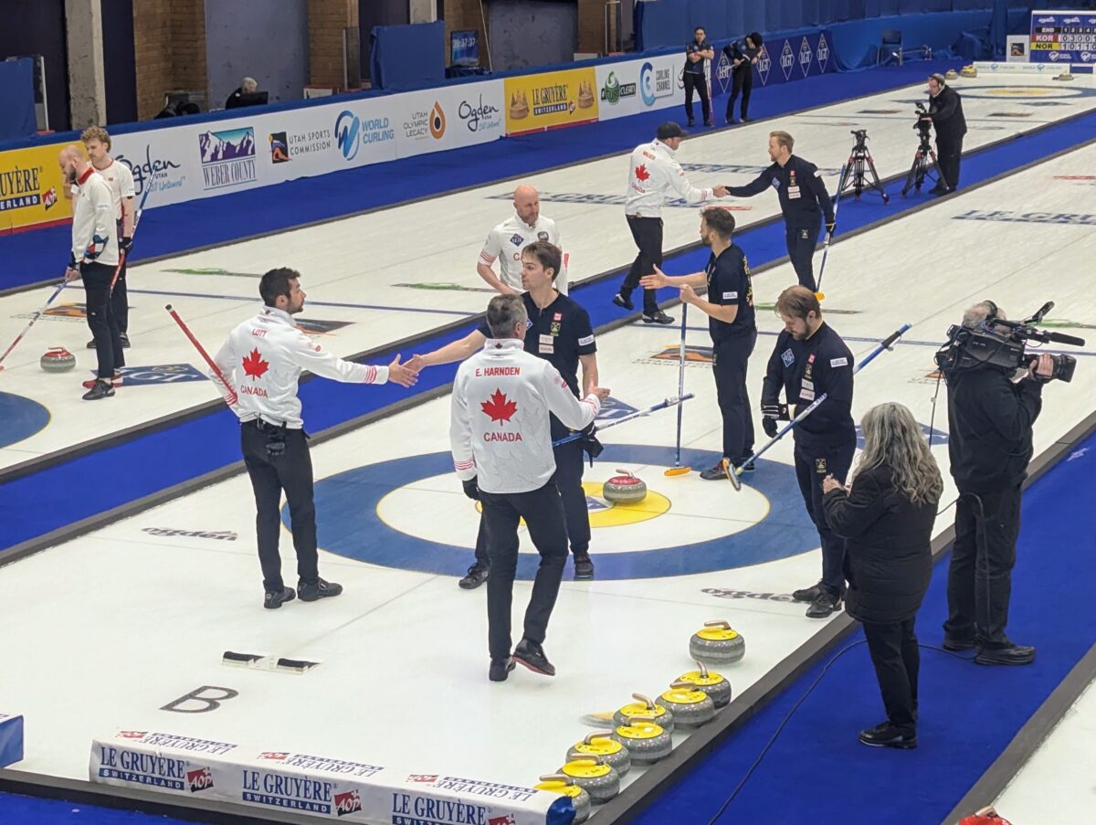 Players from Canada and Sweden exchange handshakes after Sweden conceded the game to Canada after six ends at the 2026 World Men's Curling Championship in Ogden, Utah, on Tuesday, March 31, 2026. Canada won 10-3. (Ryan Olson, Standard-Examiner)